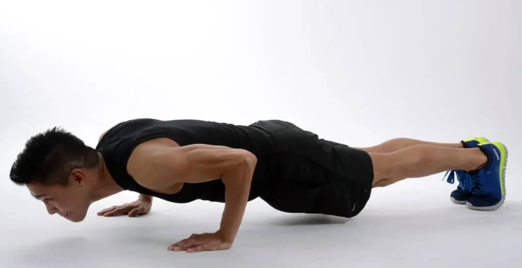 Minimalist Strength Training: 7 Proven Techniques for Great Results 2 man doing pushups in neutral setting