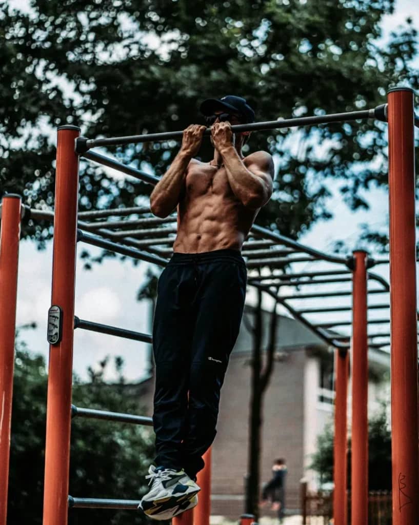 Minimalist Strength Training: 7 Proven Techniques for Great Results 3 man doing chin-ups