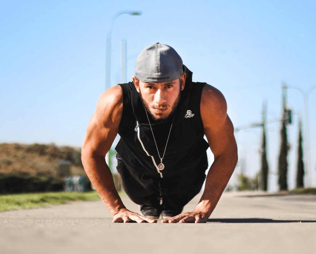 How to Master Different Push Ups: 7 Progressions for Strength and Fitness 6 man doing diamond pushups on a sidewalk