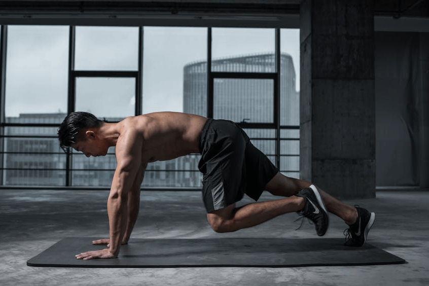 15-Minute Ab Workout for Insane Core Strength 5 man performing mountain climbers on an exercise mat